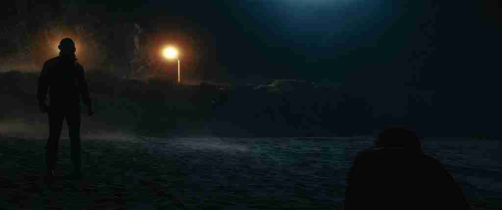 Drive beat sheet Act Two Part B beach scene: Ryan Gosling as Driver in scorpion jacket approaches Nino (Ron Perlman) on the dark beach under a single light pole, moments before drowning him in the ocean