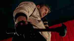 Drive beat sheet featured image hammer scene: Ryan Gosling as Driver wields a hammer over Cook in the strip club dressing room, forcing him to reveal Nino's involvement