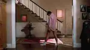 Tom Cruise dancing in a pink shirt and socks, illustrating the Catalyst moment in a Risky Business beat sheet.