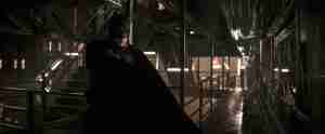 Batman Begins Beat Sheet: Iconic image of Batman on an elevated train platform after subduing Falcone, symbolizing his declaration of war.