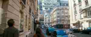Inception beat sheet featured image: Cobb and Ariadne looking up at the impossible folding Paris street in Christopher Nolan's Inception (2010), symbolizing dream layers and story structure