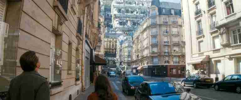 Inception beat sheet featured image: Cobb and Ariadne looking up at the impossible folding Paris street in Christopher Nolan's Inception (2010), symbolizing dream layers and story structure
