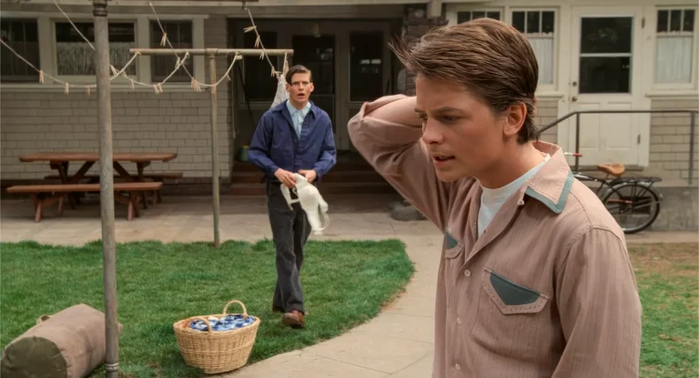 Marty McFly instructing his father in a 1955 backyard while George holds laundry, Back to the Future analysis