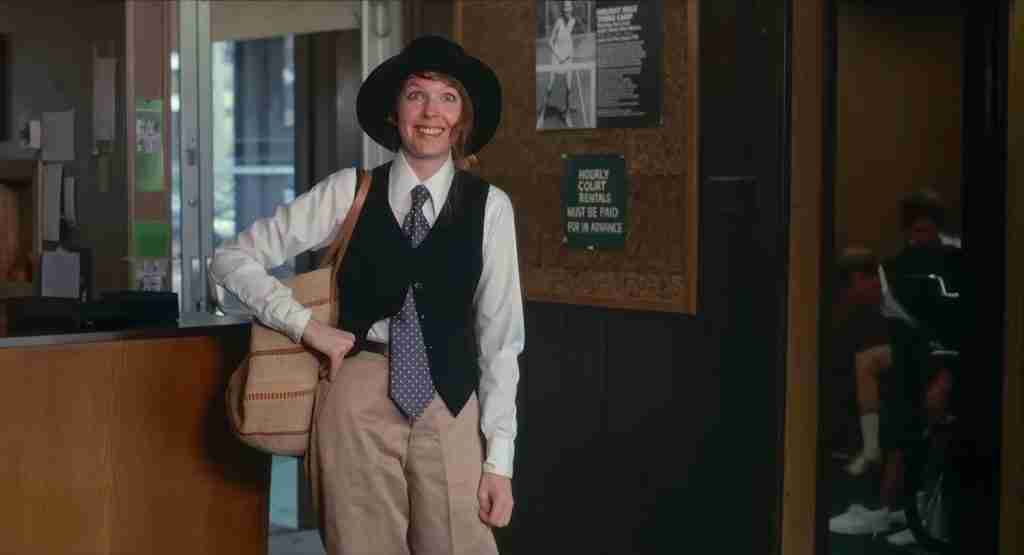 Annie Hall Diane Keaton first appearance tennis club black hat vest tie bag quirky outfit 1977 film scene