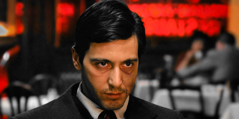 Michael Corleone (Al Pacino) intense close-up in the Bronx restaurant moments before executing Sollozzo and Captain McCluskey in The Godfather analysis