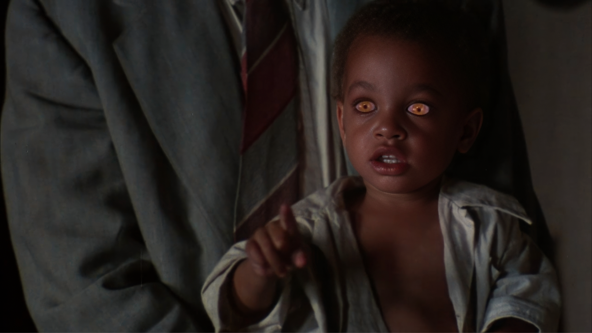 Angel Heart ending explained — Detective Sterne carries out Epiphany Proudfoot's toddler son whose glowing eyes match Louis Cyphre's, revealing the Devil fathered the child