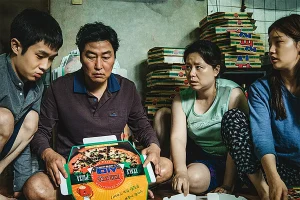 Parasite 2019 analysis: the Kim family folds pizza boxes in their banjiha semi-basement apartment