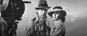 Humphrey Bogart and Ingrid Bergman in a wide shot at the airport, featured image for the Casablanca beat sheet.