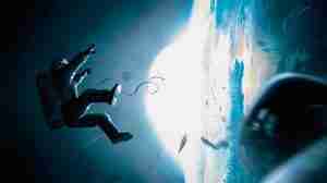 Dr. Ryan Stone (Sandra Bullock) floating untethered in space during the debris strike in Gravity.