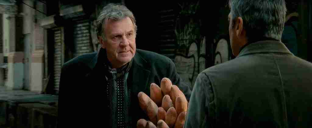 Arthur Edens confronts Michael Clayton with baguettes, asking, "If you're not the enemy, then who are you?"