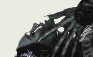 Count Orlok's grotesque, clawed hand reaches for Ellen Hutter's face, symbolizing the main conflict and supernatural possession.