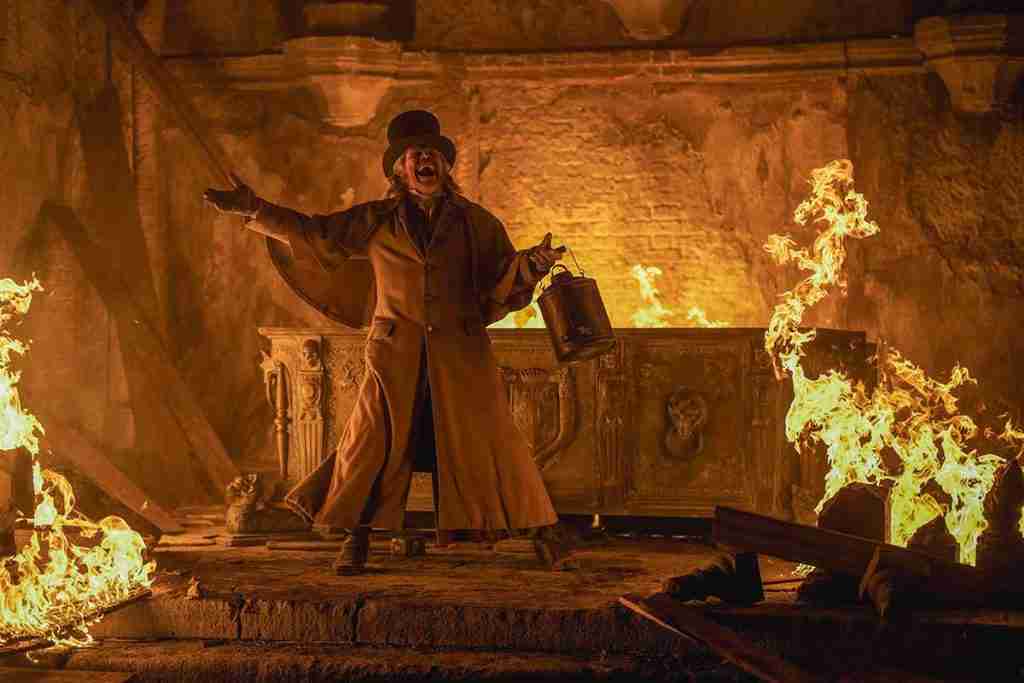 Professor Von Franz stands amid the flames of the crypt, wildly shouting or laughing, having engineered the final conflict.