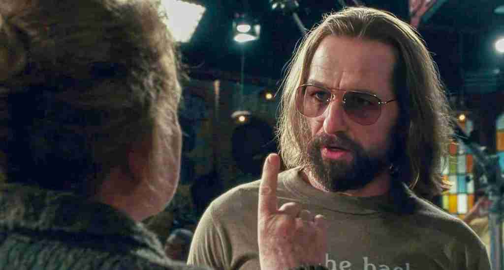 George Carlin faces off against the NBC Standards and Practices censor, symbolizing the core thematic conflict in the Saturday Night 2024 Beat Sheet.