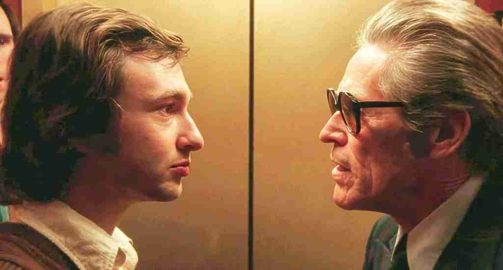 Lorne Michaels and Executive Dave Tebet (Willem Dafoe) confront each other in the elevator, representing the Bad Guys Close In moment of the Saturday Night 2024 Beat Sheet.