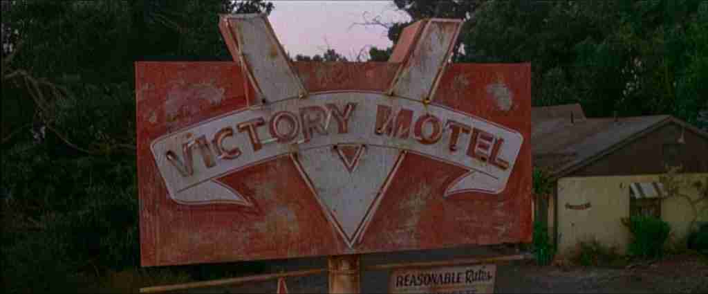 The iconic Victory Motel sign, referencing the final choice between justice and corruption in the L.A. Confidential beat sheet.