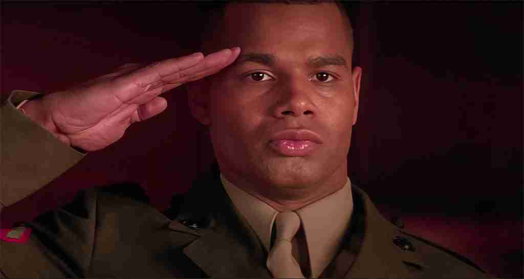 A Few Good Men analysis: Lance Corporal Harold Dawson salutes Lt. Daniel Kaffee, symbolizing the restoration of mutual respect and honor.