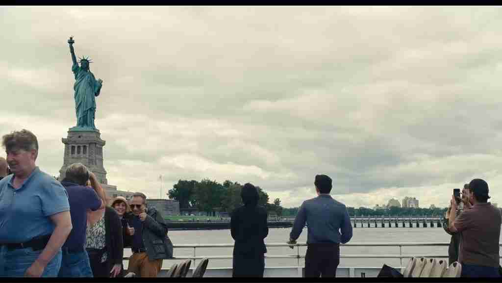 Past Lives analysis Statue of Liberty ferry Nora Hae Sung immigrant symbolism