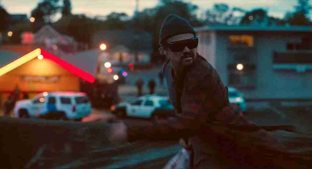 Leonardo DiCaprio as Bob Ferguson fleeing Baktan Cross in a One Battle After Another analysis.