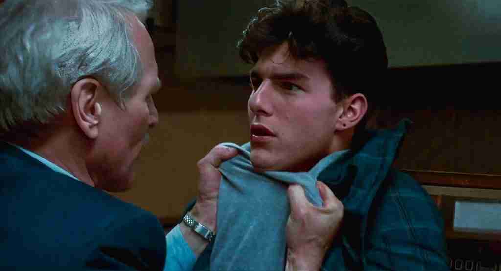 The Color of Money analysis still: Paul Newman as Eddie Felson grabs Tom Cruise as Vincent Lauria by the shirt in pool hall confrontation