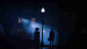 The Exorcist Structural Analysis: Father Merrin arrives at the MacNeil home silhouetted by a streetlamp.