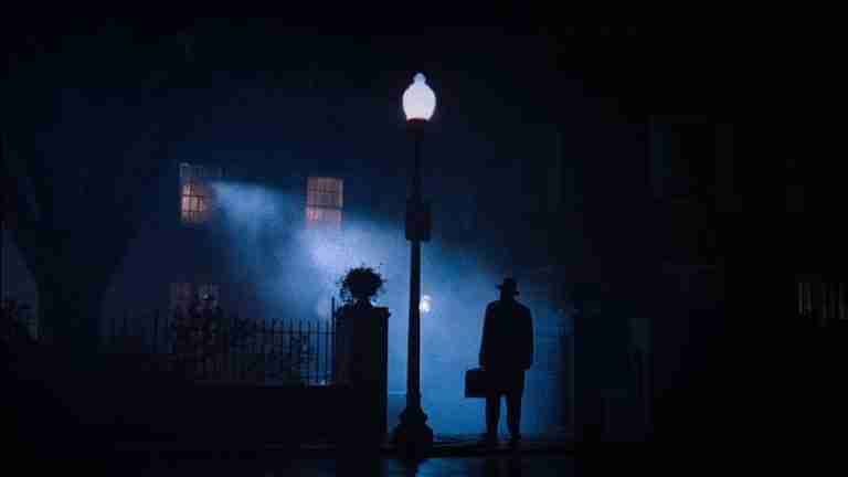 The Exorcist Structural Analysis: Father Merrin arrives at the MacNeil home silhouetted by a streetlamp.