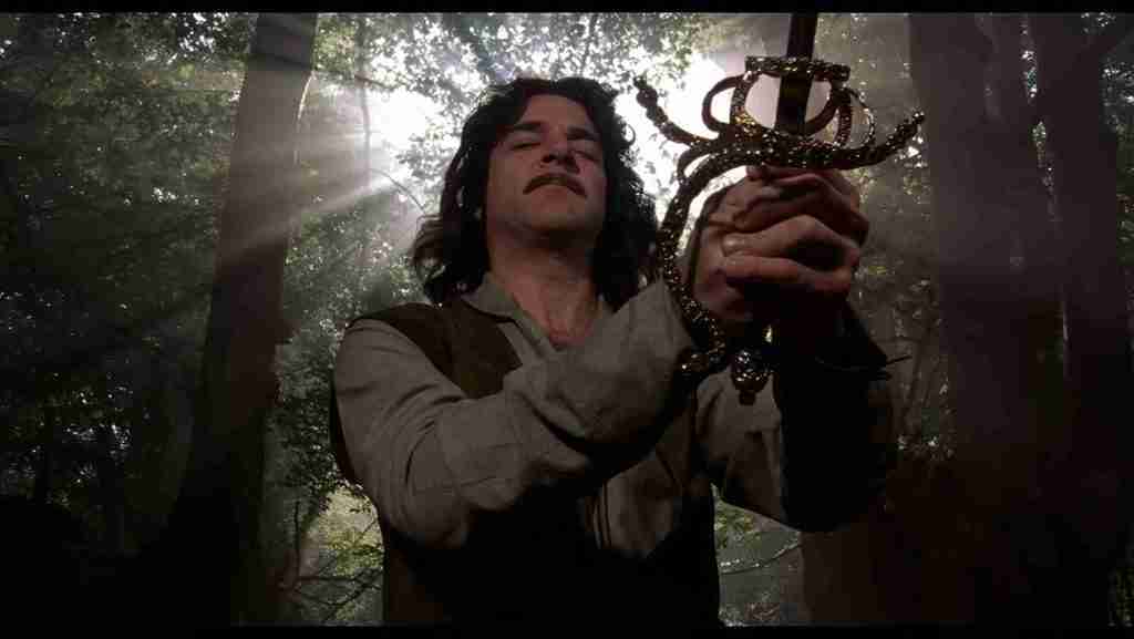 Inigo Montoya raising sword in desperate prayer, asking his father to guide him to the man who can help, The Princess Bride