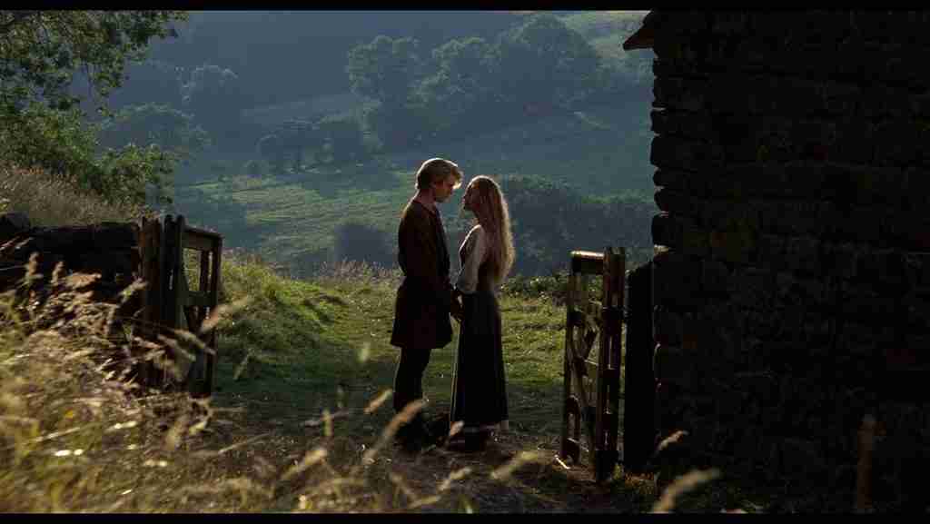 Westley and Buttercup face to face in golden morning light on the farm, early romance scene in The Princess Bride