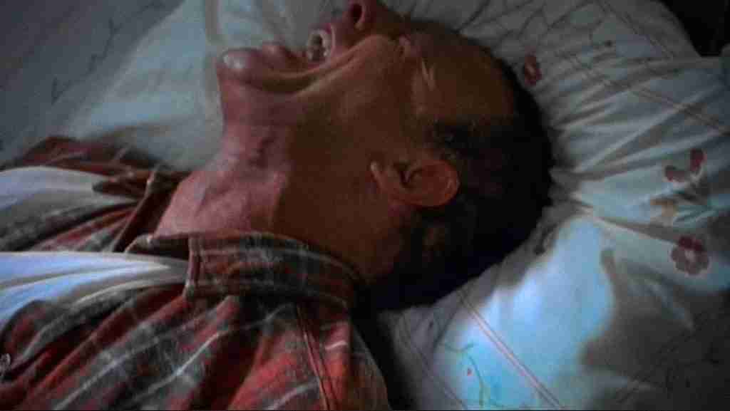 James Caan as Paul Sheldon flat on his back in excruciating pain during the hobbling scene in Misery (1990) – the devastating "All is Lost" moment as it happens in this Misery analysis.