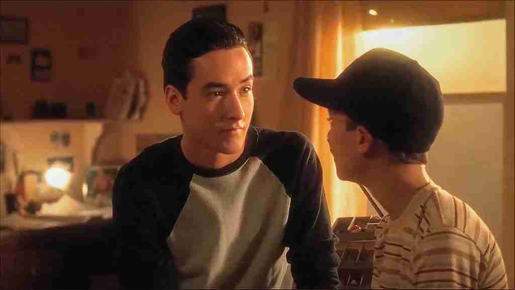 Stand By Me analysis: Denny Lachance (John Cusack) talking to young Gordie (Wil Wheaton) in their bedroom, representing the familial loss that fuels Gordie's internal conflict.
