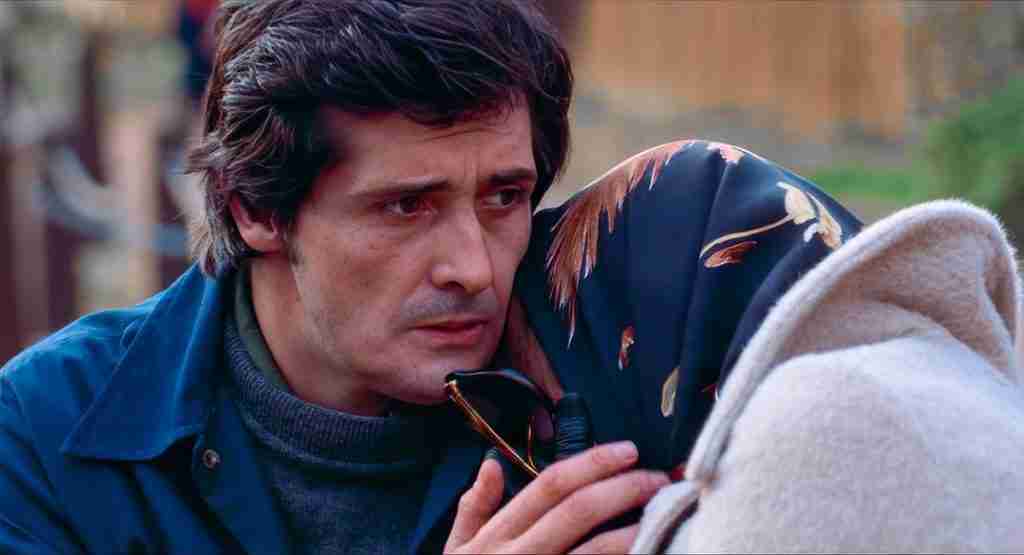 The Exorcist beat sheet midpoint: Chris MacNeil pleading with Father Karras "we need a priest" in street scene
