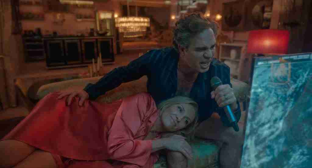 Mickey 17 analysis key themes image: Mark Ruffalo as Kenneth Marshall ranting with microphone over Toni Collette in private quarters, declaring Niflheim the planet of purity, embodying autocratic colonialism