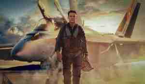 Tom Cruise as Maverick standing in front of F-14 Tomcat in Top Gun: Maverick promotional poster