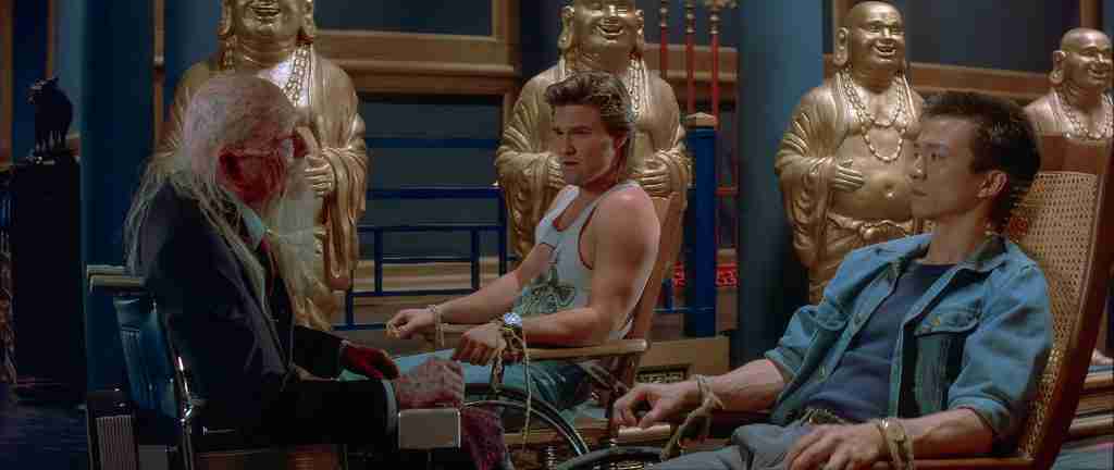 Jack Burton and Wang Chi facing Lo Pan in wheelchair during capture scene in Big Trouble in Little China analysis