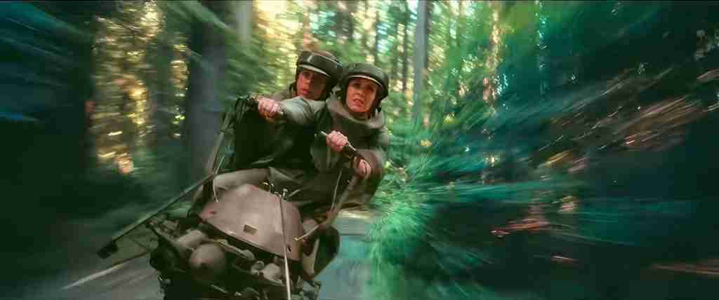 Leia driving speeder bike with Luke behind during Endor chase in Return of the Jedi