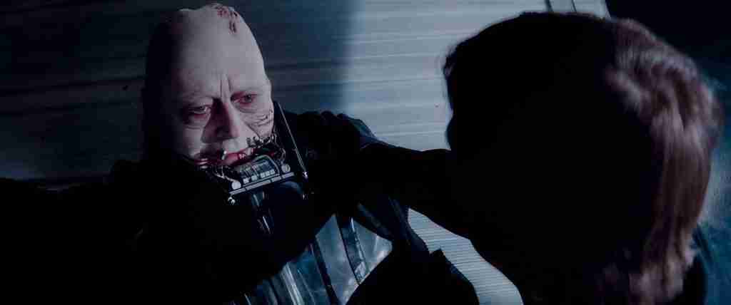 Luke Skywalker removes Darth Vader's mask revealing Anakin in Return of the Jedi redemption death scene