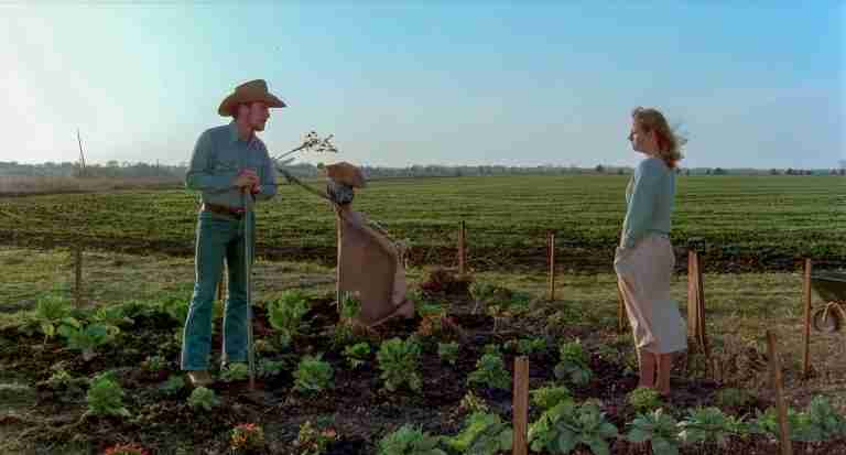 Robert Duvall and Tess Harper in a barren Texas garden during the pivotal "I don't trust happiness" scene from Tender Mercies.