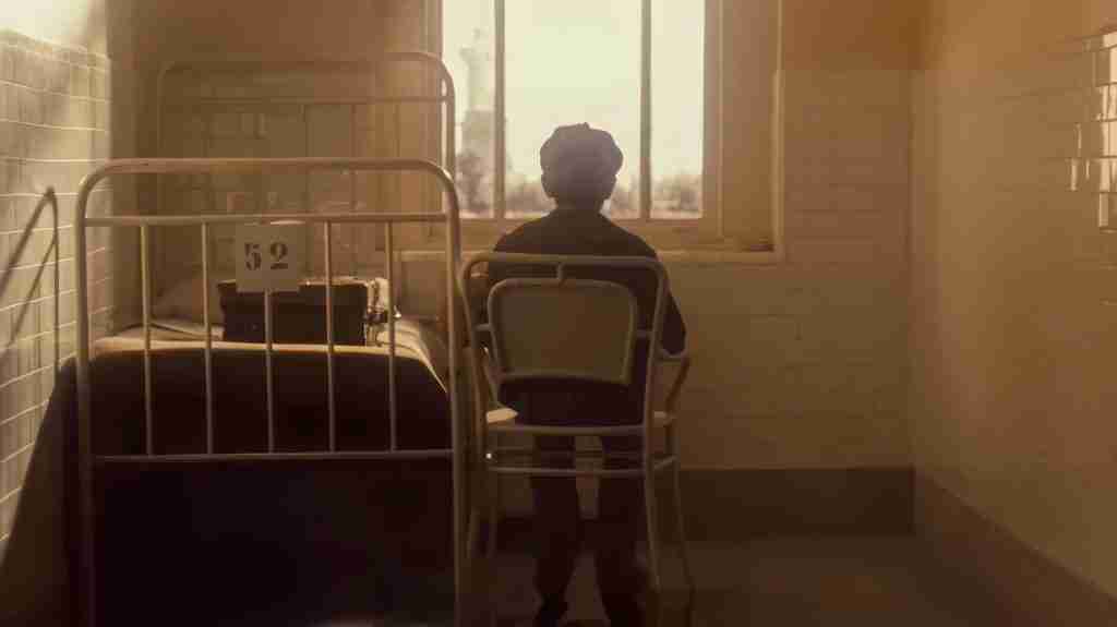 The Godfather Part II analysis: Young Vito Corleone looks out the window at the Statue of Liberty upon arriving at Ellis Island.