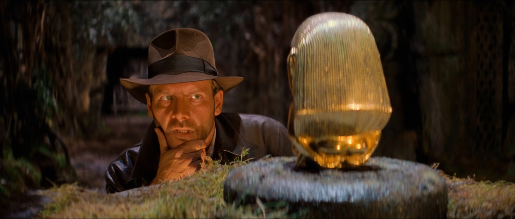 Indiana Jones reaching for the golden idol in Raiders of the Lost Ark — the IMDb and box office #1 of 1981 that lost Best Picture to Chariots of Fire, one of the most cited examples in the Oscars best picture data of the Academy standing alone