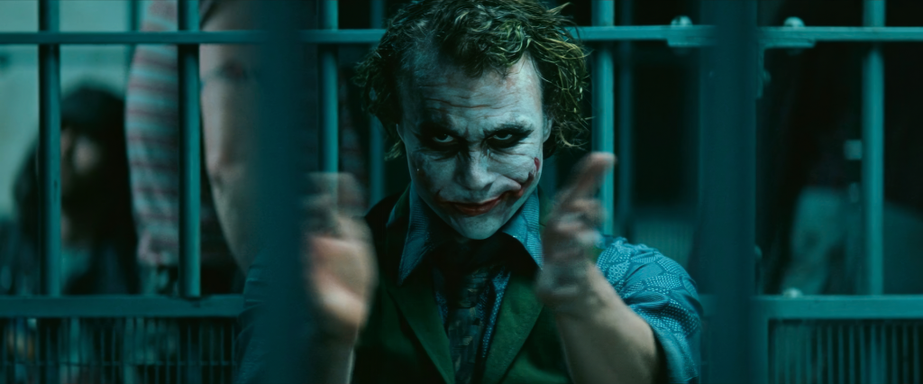 The Joker clapping in a jail cell in The Dark Knight — the IMDb #3 all-time and 2008 box office champion that was not even nominated for Best Picture, prompting the Academy to expand nominations from five to ten films