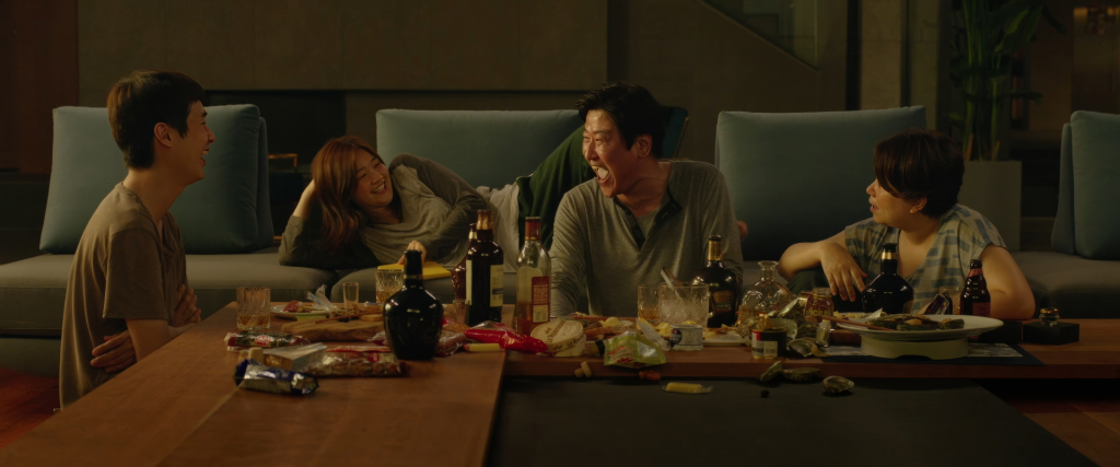 The Kim family celebrating in the Park house in Parasite — the 2019 Best Picture winner that also topped IMDb and Metacritic for its year, representing a rare convergence in the Oscars best picture data as the first non-English language film to win