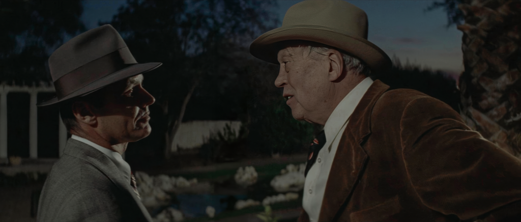 Noah Cross confronts Jake Gittes face to face in Chinatown 1974