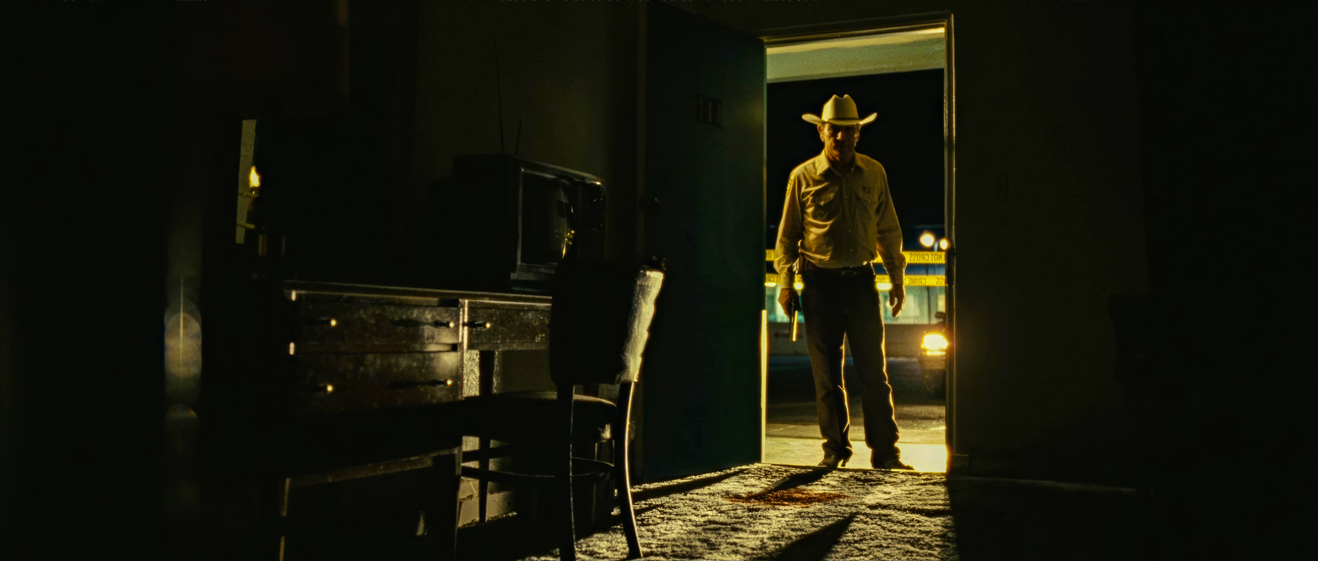 no country for old men screenplay Sheriff Bell enters dark motel room looking for Chigurh