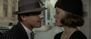Chinatown neo-noir: Jake Gittes, nose bandaged, faces Evelyn Mulwray in a veiled black hat, 1974.