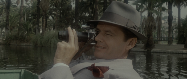 Jake Gittes photographing Hollis Mulwray and Katherine at Echo Park in Chinatown 1974