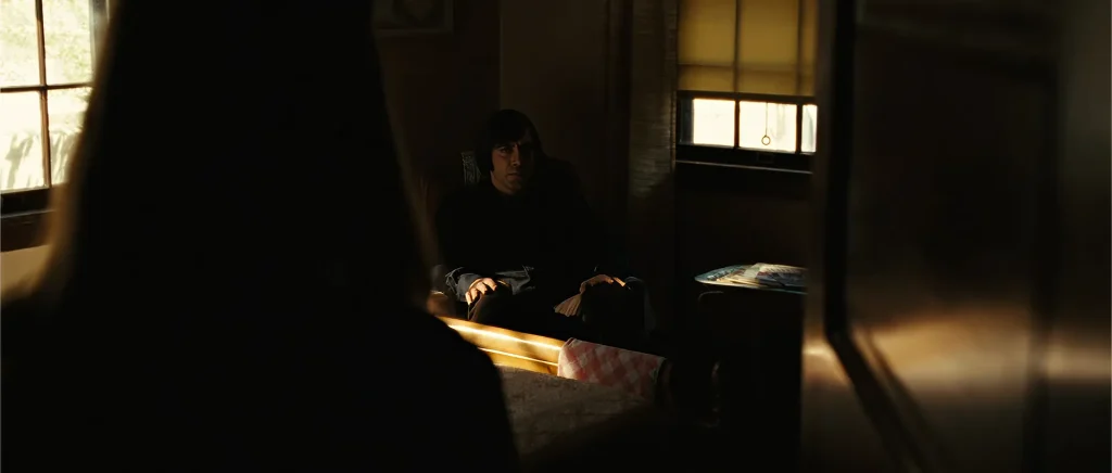No Country for Old Men Carla Jean coin toss scene — Anton Chigurh waiting in her dead mother's house
