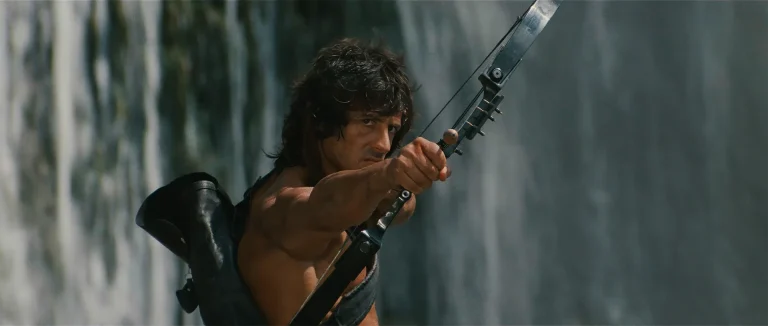 Sylvester Stallone as John Rambo drawing his compound bow in Rambo: First Blood Part II
